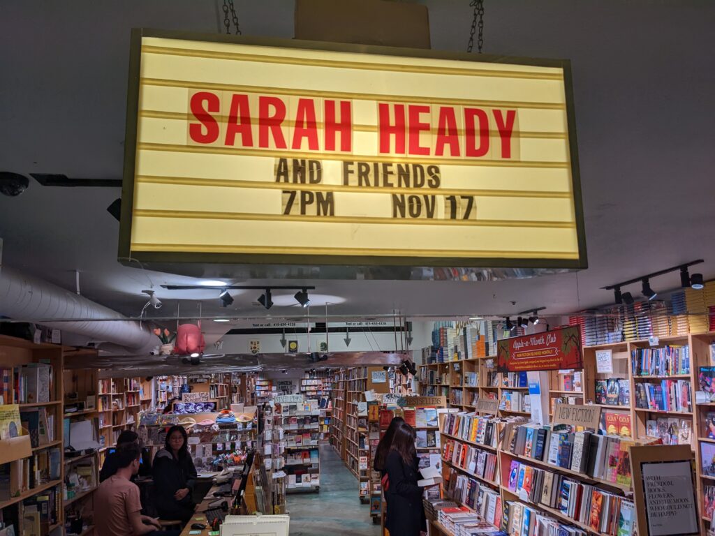 Marqee over bookstore that says "Sarah Heady and Friends" with the date Nov 17